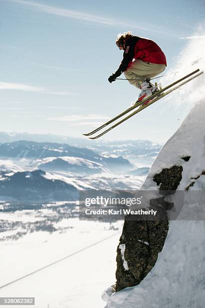 skier flying off a cliff - jackson hole stock pictures, royalty-free photos & images