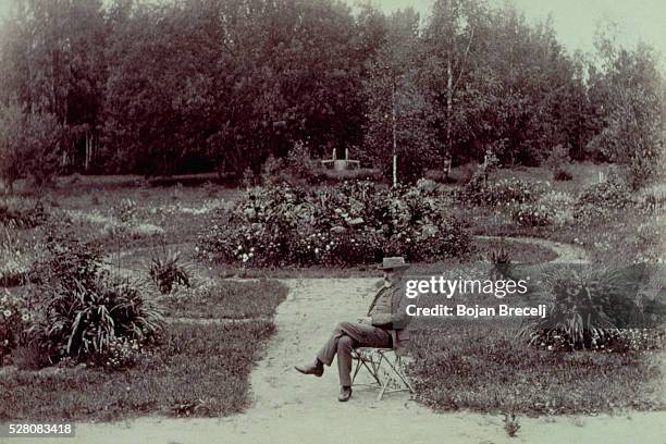 The Russian composer Tchaikovsky sits in his garden at Klin. | Location: Klin, Russia.