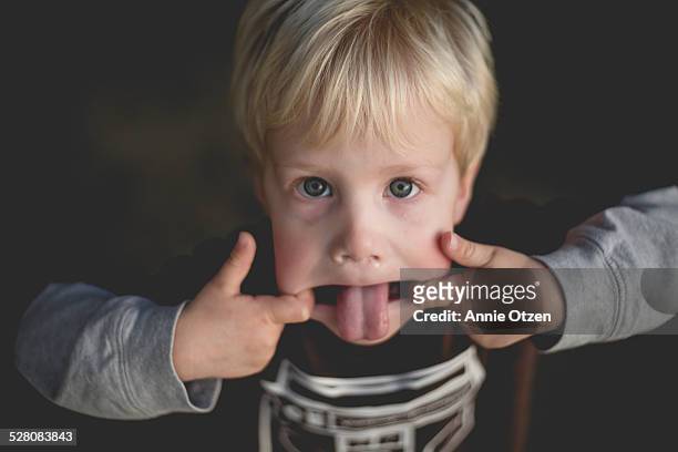 silly little boy - annie otzen stock pictures, royalty-free photos & images