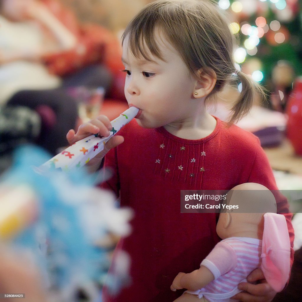 Lttle girl blowing noise markers