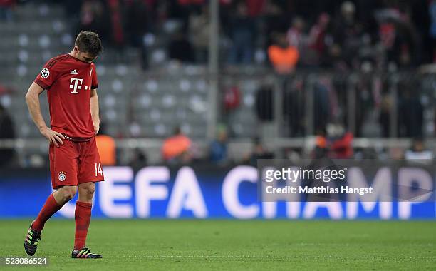 Xabi Alonso of Muenchen shows his disappointment after the UEFA Champions League semi final second leg match between FC Bayern Muenchen and Club...