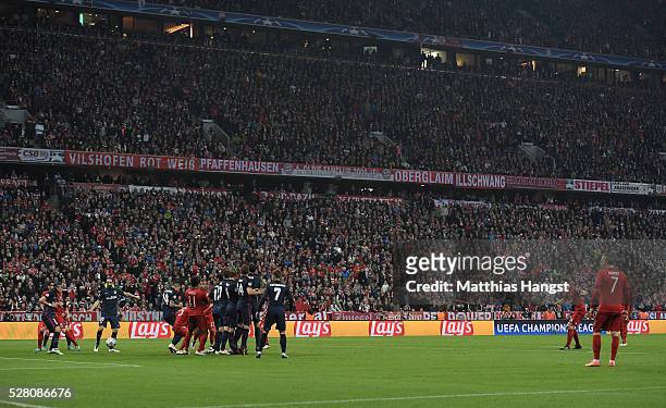 Xabi Alonso of Bayern Munich scores their first goal from a free kick during the UEFA Champions League semi final second leg match between FC Bayern...