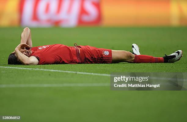 Robert Lewandowski of Bayern Munich is injured during the UEFA Champions League semi final second leg match between FC Bayern Muenchen and Club...