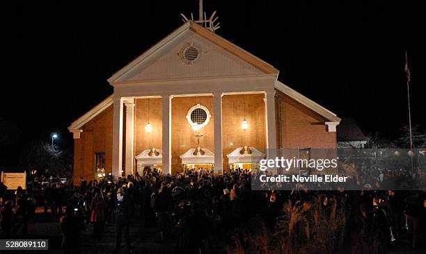 Citizens of Newtown gather at Saint Rose of Lima church to hold a vigil for the 26 victims of the Sandy Hook Elementary school shooting in Sandy...