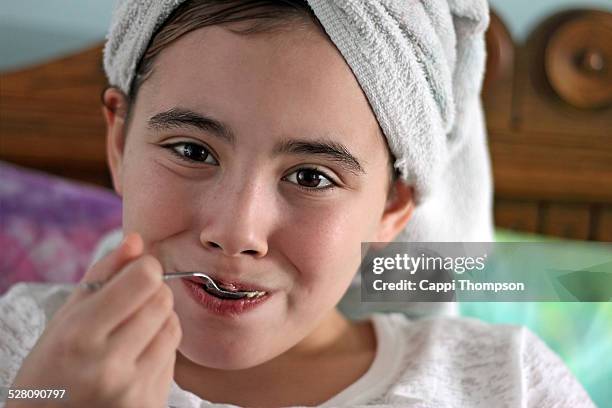 child with spoon in mouth - silver spoon in mouth stock pictures, royalty-free photos & images