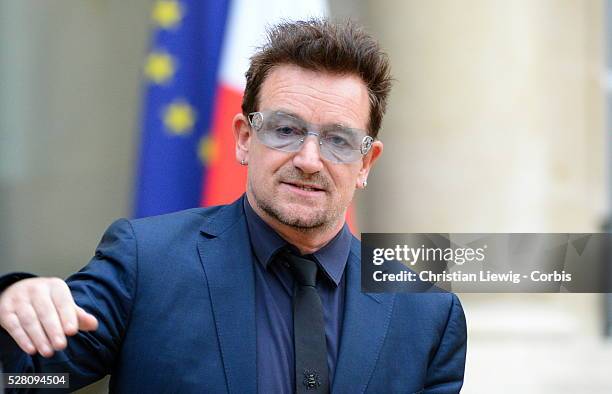 French President Francois Hollande welcomes Irish musician and humanitarian activist Bono and Microsoft co-founder turned global philanthropist Bill...