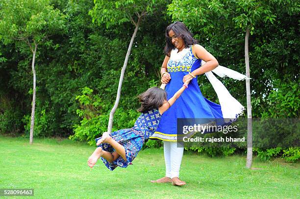 mother & daughter playing - ahmedabad stock pictures, royalty-free photos & images
