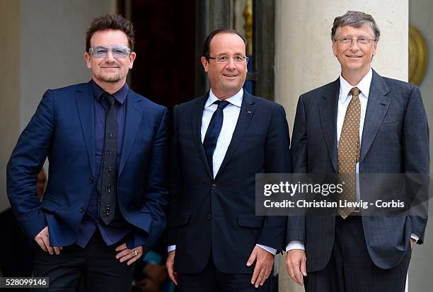 French President Francois Hollande welcomes Irish musician and humanitarian activist Bono and Microsoft co-founder turned global philanthropist Bill...