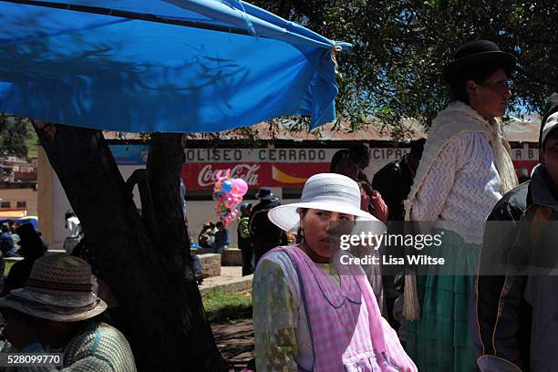 An Aymaran woman selling traditional food during the Fiesta de la Virgen de la Candelaria is held to honour the Virgen or the Dark Virgin of the Lake...