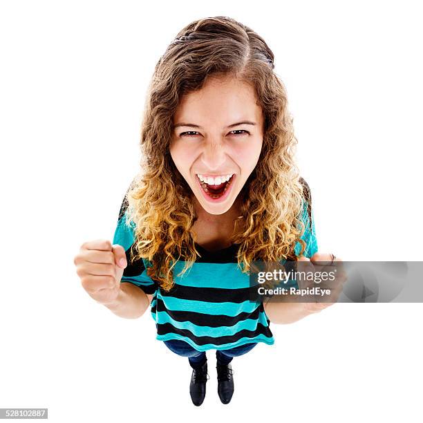 looking down at excited young woman cheering, her fists clenched - fish eye stock pictures, royalty-free photos & images