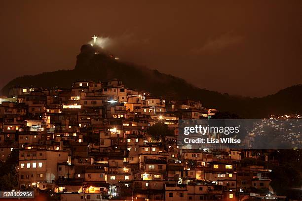 View from the hills of Santa Teresa towards the iconic Cristo Redentor statue and the favela Morro da Coroa on October 3, 2010 in Rio de Janeiro,...