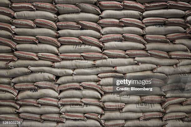 Bags of rice sit stacked at a National Food Authority warehouse in Quezon City, Metro Manila, the Philippines on Tuesday, May 3, 2016. Rice damage in...