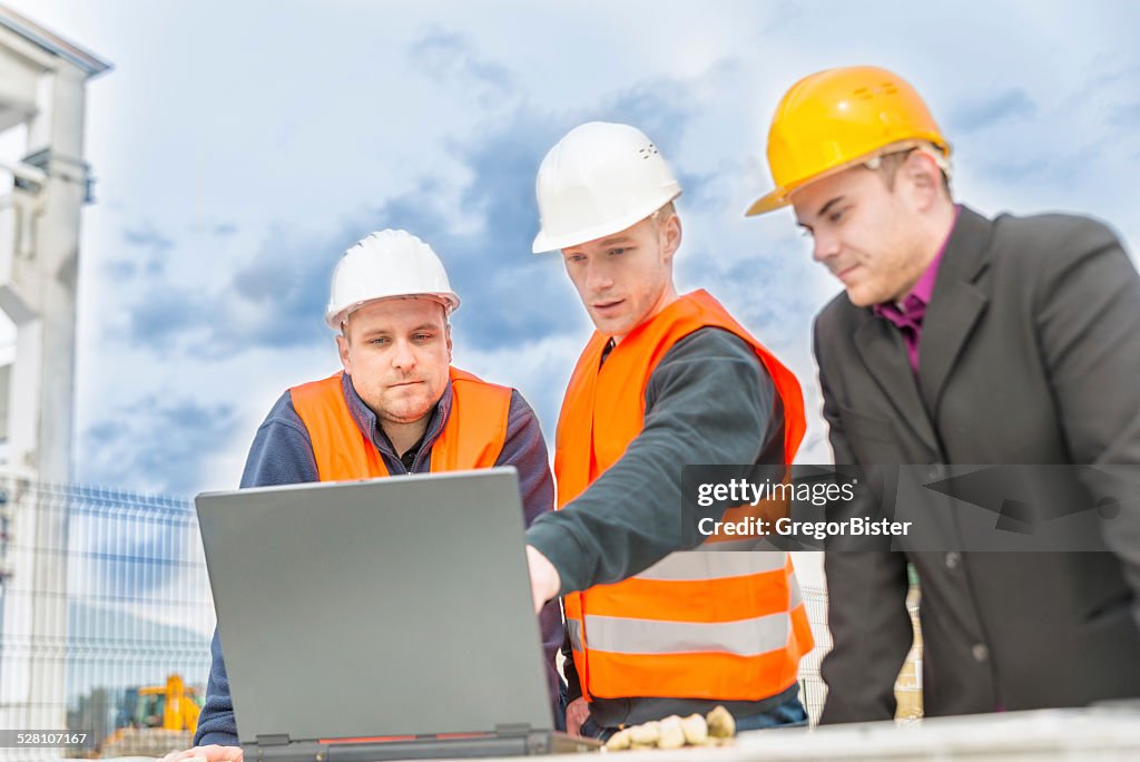 Checking plans on laptop