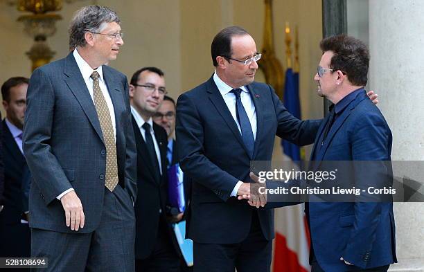 French President Francois Hollande welcomes Irish musician and humanitarian activist Bono and Microsoft co-founder turned global philanthropist Bill...