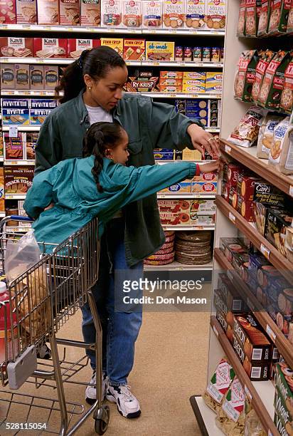 mother and daughter grocery shopping - vintage mother and child stock pictures, royalty-free photos & images