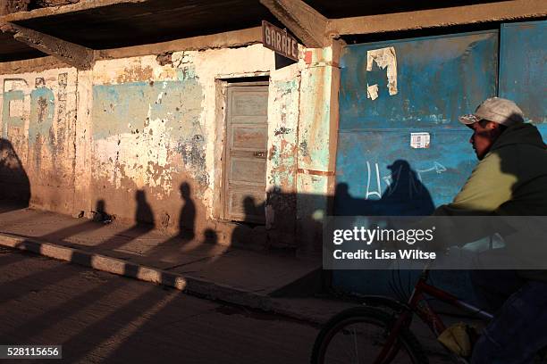 Virgen de la Candelaria A man rides a bicycle through the streets of Copacabana during the Fiesta de la Virgen de la Candelaria is held to honour the...