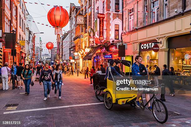 soho, chinatown, rickshaw in wardour street - brouette stock pictures, royalty-free photos & images