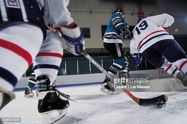 hockey players in action - ice hockey stock pictures, royalty-free photos & images