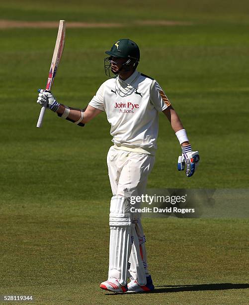 Stuart Broad of Nottinghamshire celebrates after scoring a half century during the Specsavers County Championship division one match between...