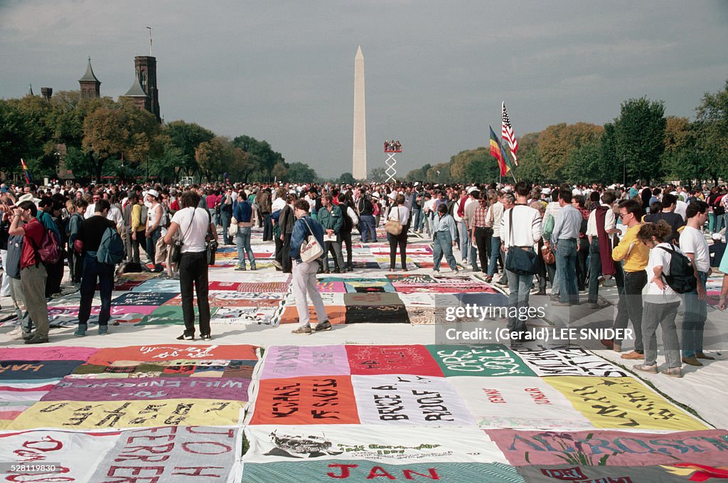 People Looking at the AIDS Quilt