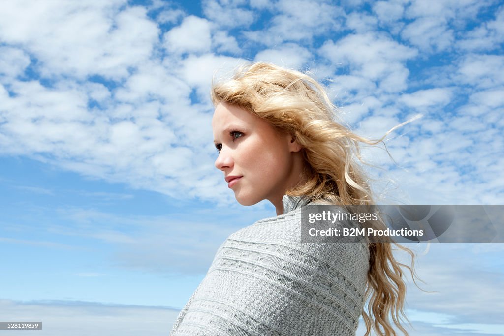 Blond woman wrapped in blanket