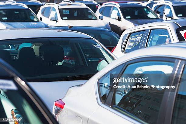 parked cars in row - car sales stock pictures, royalty-free photos & images