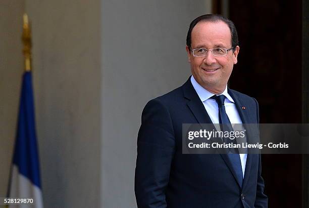 French President Francois Hollande welcomes Irish musician and humanitarian activist Bono and Microsoft co-founder turned global philanthropist Bill...