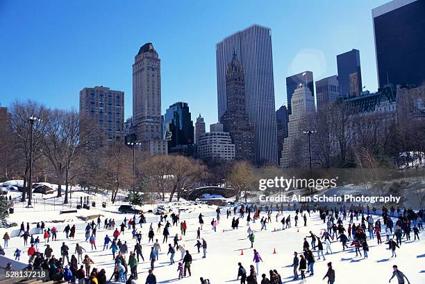 ice skating at wollman rink - central park winter stock pictures, royalty-free photos & images