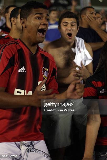 Flamengo fans supporting their team, waving flags and singing during the Flamengo v Vasco da Gama, Futebol Brasileirao 2010 League match at the...