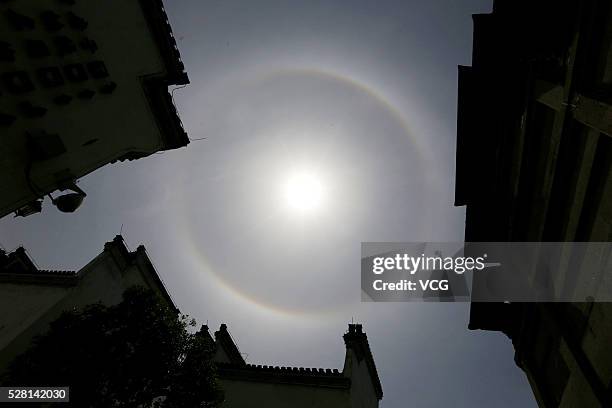 Image shows solar halo appears in the sky on May 4, 2016 in Huangshan, Anhui Province of China. A halo is an optical phenomenon produced by light...