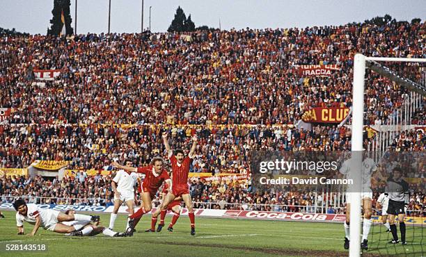 Liverpool striker Ian Rush celebrates as full back Phil Neal scores the Liverpool goal during the 1984 European Cup Final between AS Roma and...