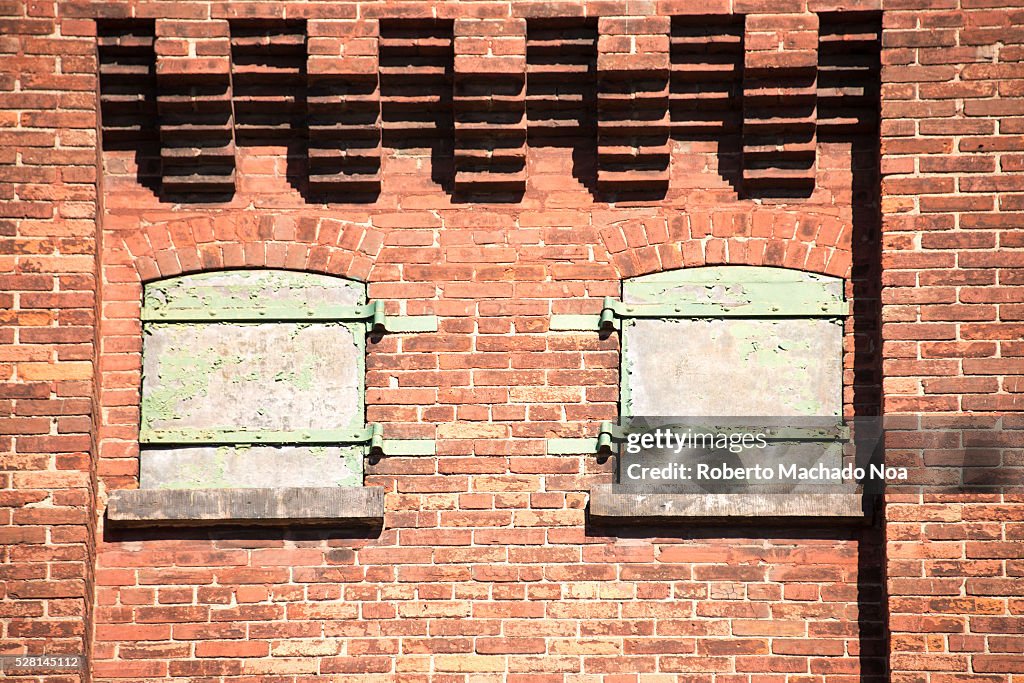 Distillery district: old windows in original brick wall. The...