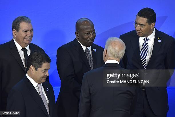 Vice President Joe Biden chats with Saint Maarten Prime Minister William Marlin after posing for a group photo during the US, Caribbean, Central...