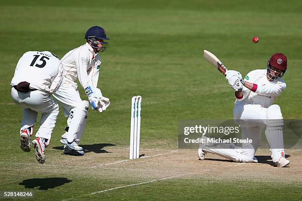 Marcus Trescothick of Somerset pulls a shot to the legside as Steven Croft of Lancashire takes evasive action during day four of the Specsavers...