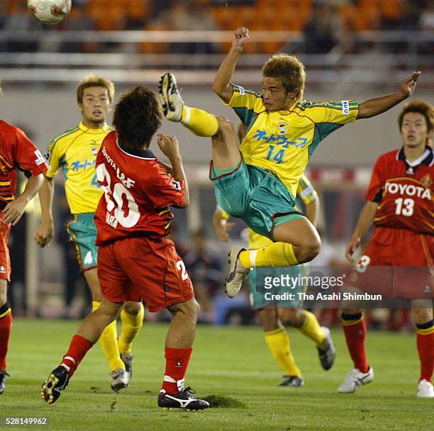 Yuto Sato of JEF United Ichihara and Ryuta Hara of Nagoya Grampus Eight compete for the ball during the J.League match between Nagoya Grampus Eight...