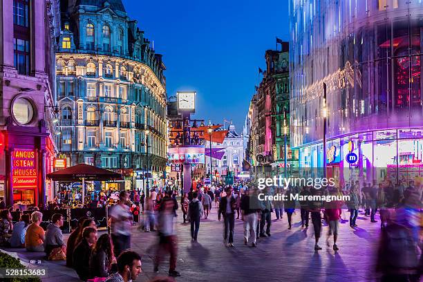 west end, people in leicester square - night out stock pictures, royalty-free photos & images