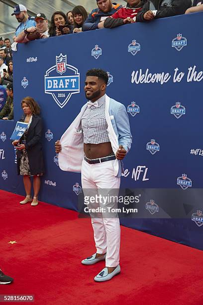 Former Ohio State running back Ezekiel Elliott with crop top dress shirt showing midriff on red carpet before selection process at Auditorium Theatre...
