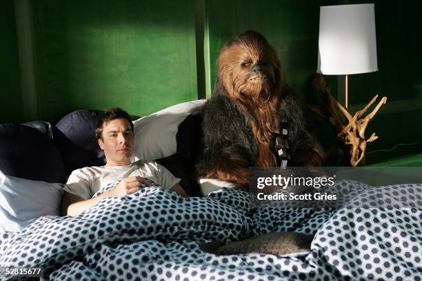 Actor Jimmy Fallon lies in bed with Chewbacca during filming for a promo for the 2005 MTV Movie Awards at Paris Studios May 12, 2005 in Queens...