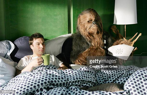 Actor Jimmy Fallon lies in bed with Chewbacca during filming for a promo for the 2005 MTV Movie Awards at Paris Studios May 12, 2005 in Queens...