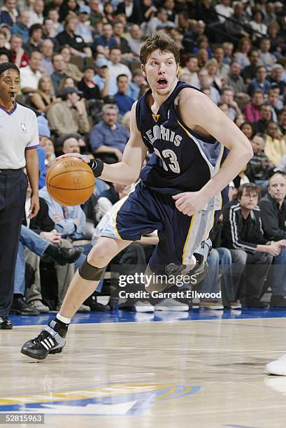 Mike Miller of the Memphis Grizzlies dribbles against the Denver Nuggets on April 15, 2005 at the Pepsi Center in Denver, Colorado. NOTE TO USER:...