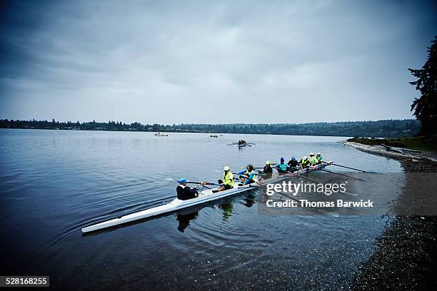 mature female rowers preparing to practice - coxed rowing bildbanksfoton och bilder