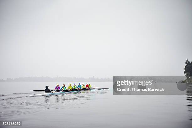 mature women rowing eight person rowing shell - crew rowing stock pictures, royalty-free photos & images