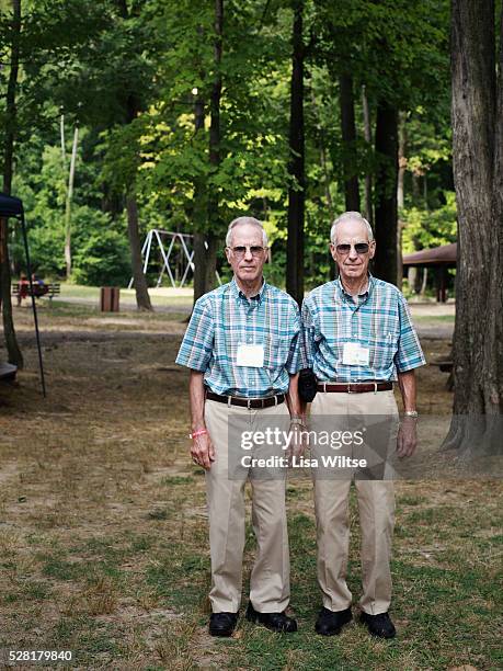 Identical twin brothers Dick and Bill Bundick, from Maryland, posing for a portrait during the 32nd annual Twins Days Festival in Twinsburg, Ohio...