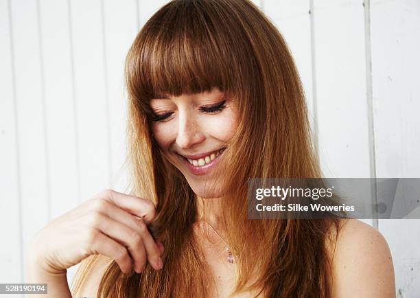 portrait of a content middle-aged woman outdoors - bangs stock-fotos und bilder