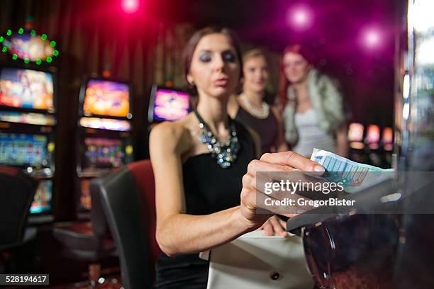 woman in casino - teen pokies stock pictures, royalty-free photos & images