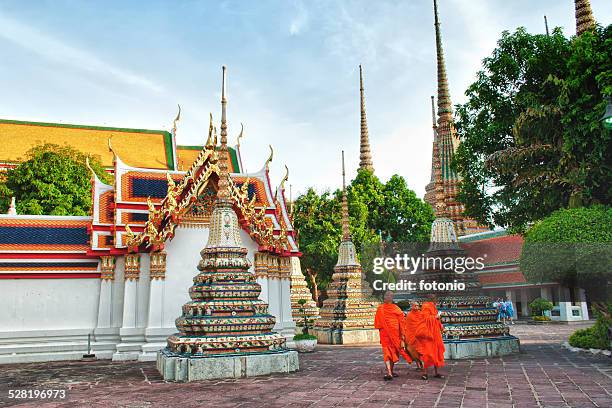 monks in a temple - reclining buddha statue stock pictures, royalty-free photos & images