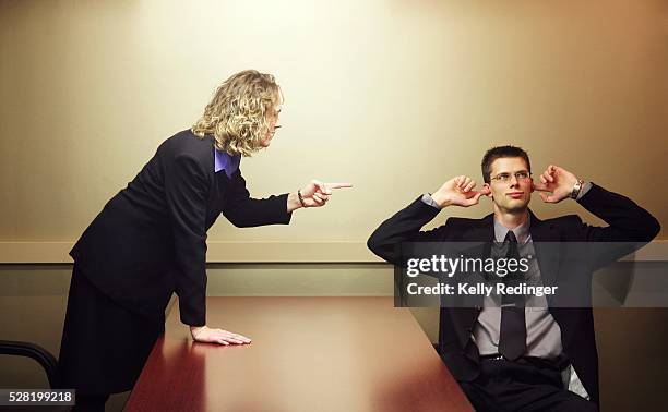 business people arguing - vingers in de oren stockfoto's en -beelden