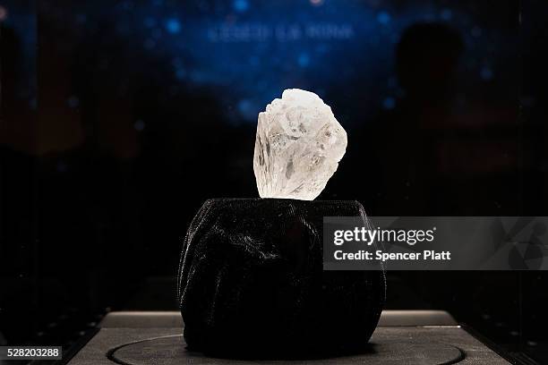 The 1109-carat rough Lesedi La Rona diamond, the biggest rough diamond discovered in more than a century, sits in a display case at Sotheby's on May...