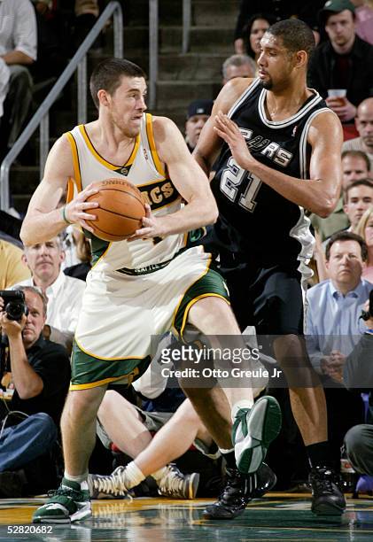 Nick Collison of the Seattle SuperSonics drives against Tim Duncan of the San Antonio Spurs in Game three of the Western Conference Semifinals during...