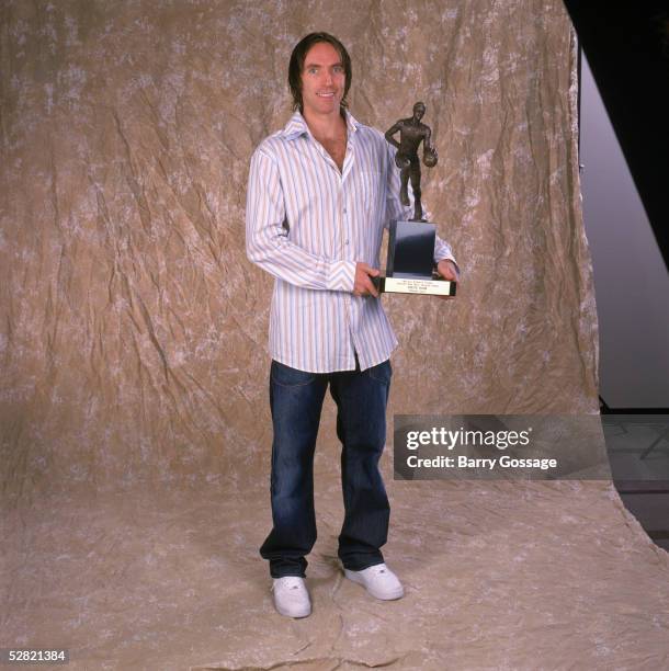 Steve Nash of the Phoenix Suns poses with the Maurice Podoloff Trophy for the NBA's Most Valuable Player for the 2004-2005 season at America West...